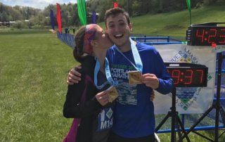 Celebrating with our medals at the end of New River Marathon Race