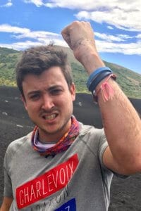 Kyle after volcano boarding with a scraped arm