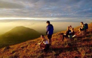 Group watching the sunset from the top of el hoyo volcano