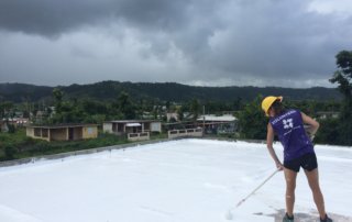 Applying sealant to a roof in Puerto Rico with All Hands and Hearts