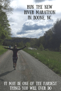 Running with arms out during new river marathon in the countryside of boone nc