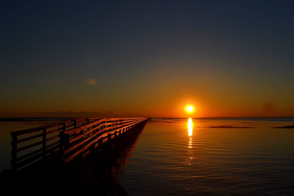 Sunset over a dock in Cape Cod