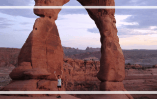 Arches National Park with a light purple sunset in the background