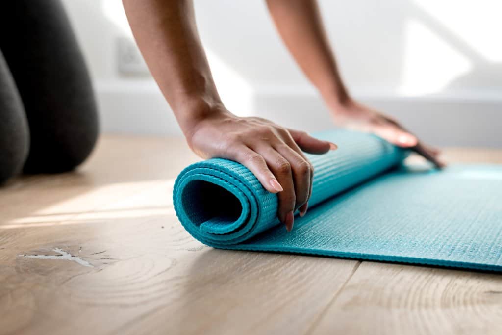 yoga mat being unrolled