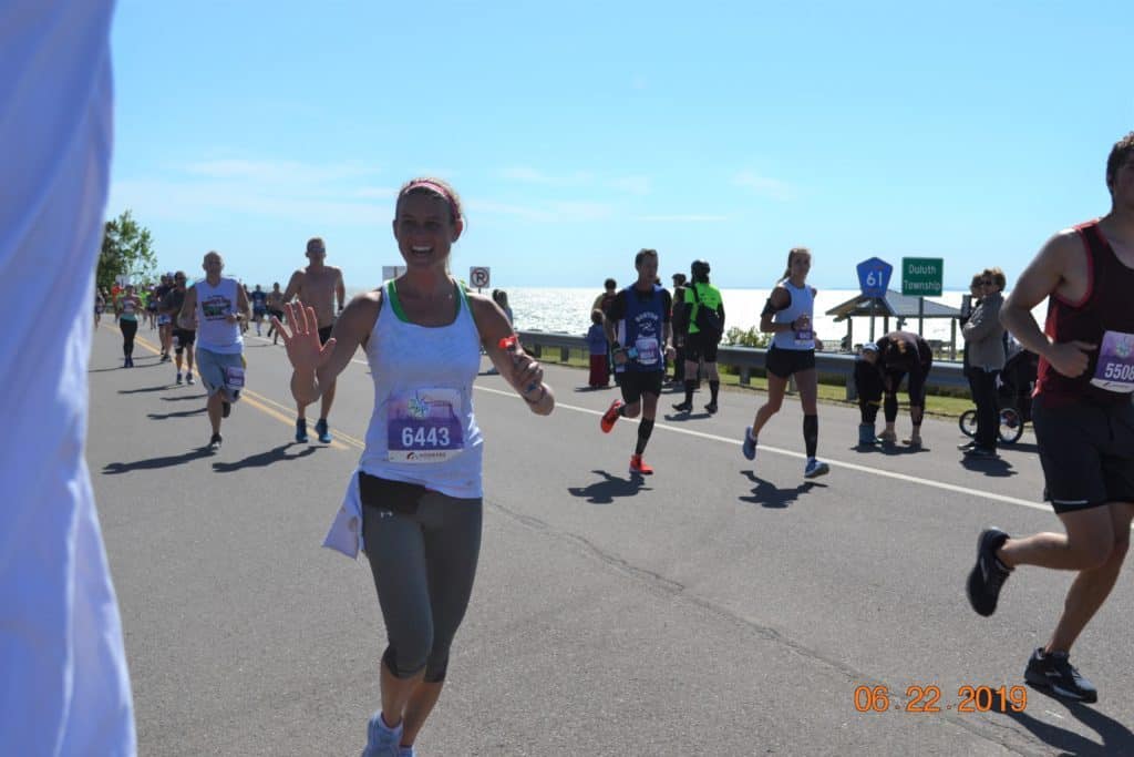 Runner in Grandma's Marathon along Lake Superior