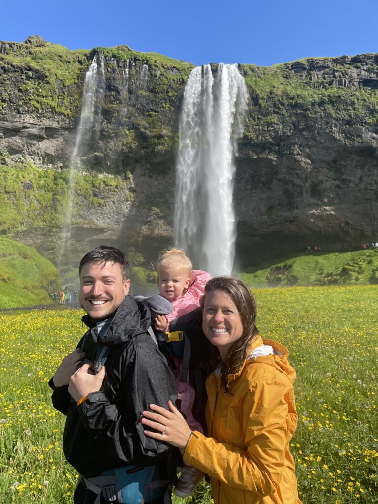 Family picture at Seljalandsfoss Waterfall Iceland with a toddler
