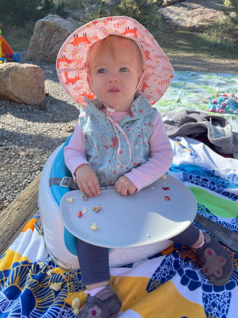1 year old eating while camping