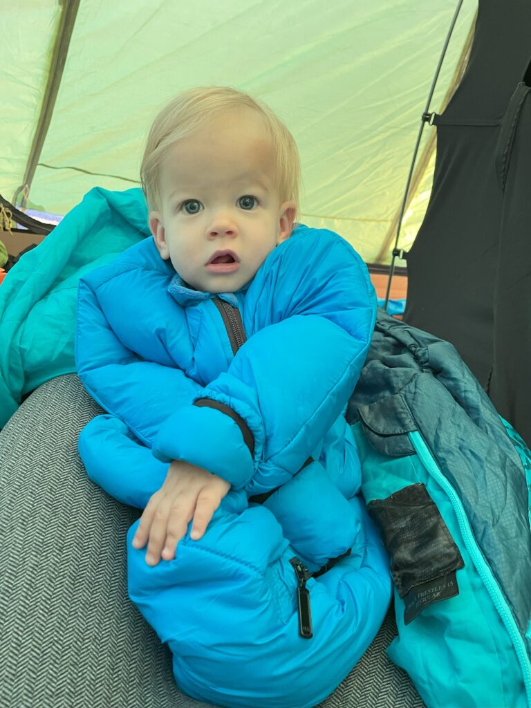1 year old camping wearing Morrison wearable sleeping bag