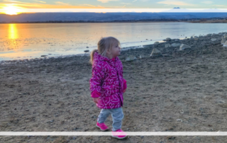 How Travel Changes when you have a baby featured image, toddler at a mountain sunset
