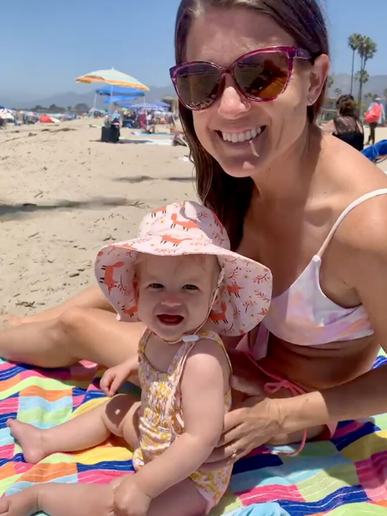 Infant and mom on Carpinteria beach