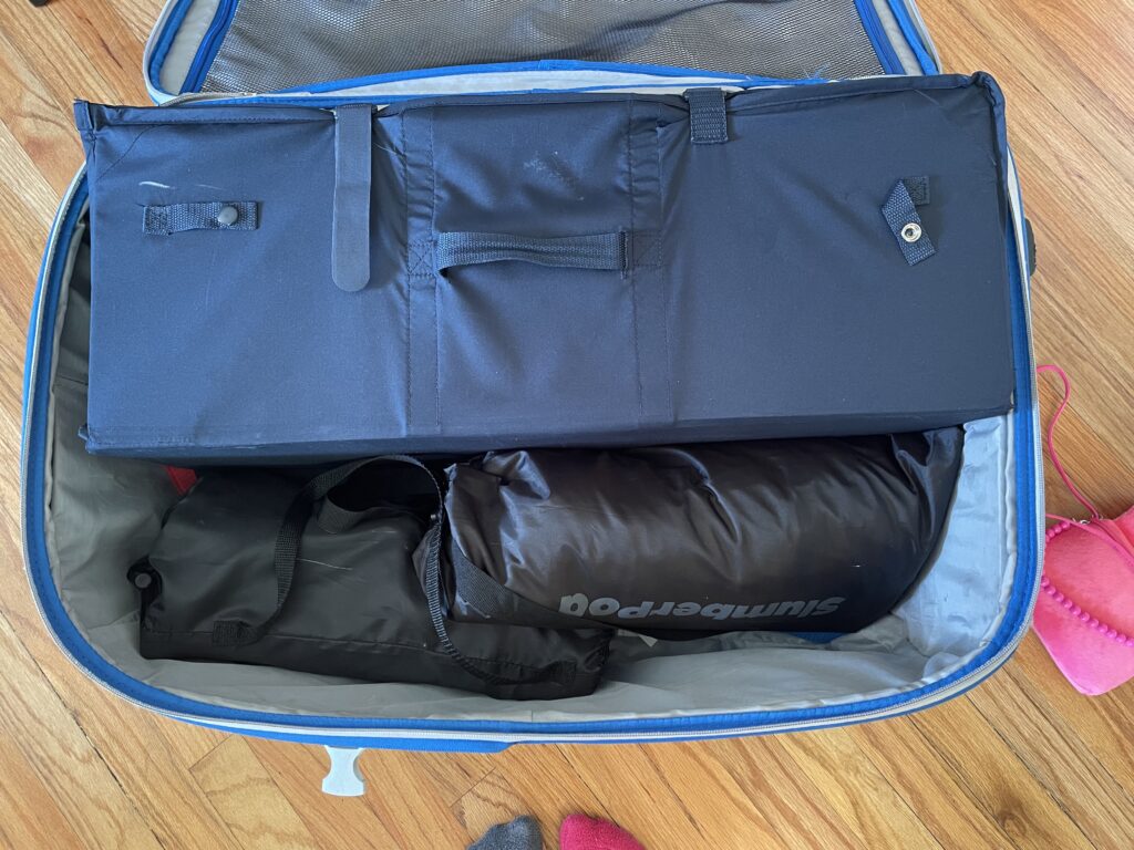 suitcase with toddler gear taking up all the space