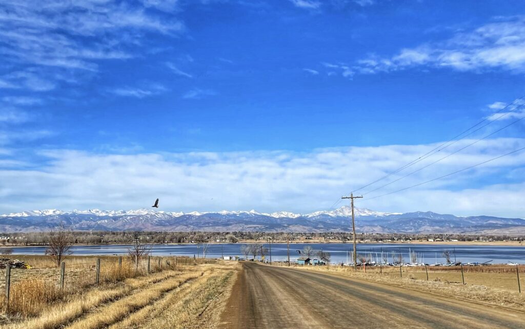Union Reservoir from dirt road Longmont, Colorado with bald eagle flying