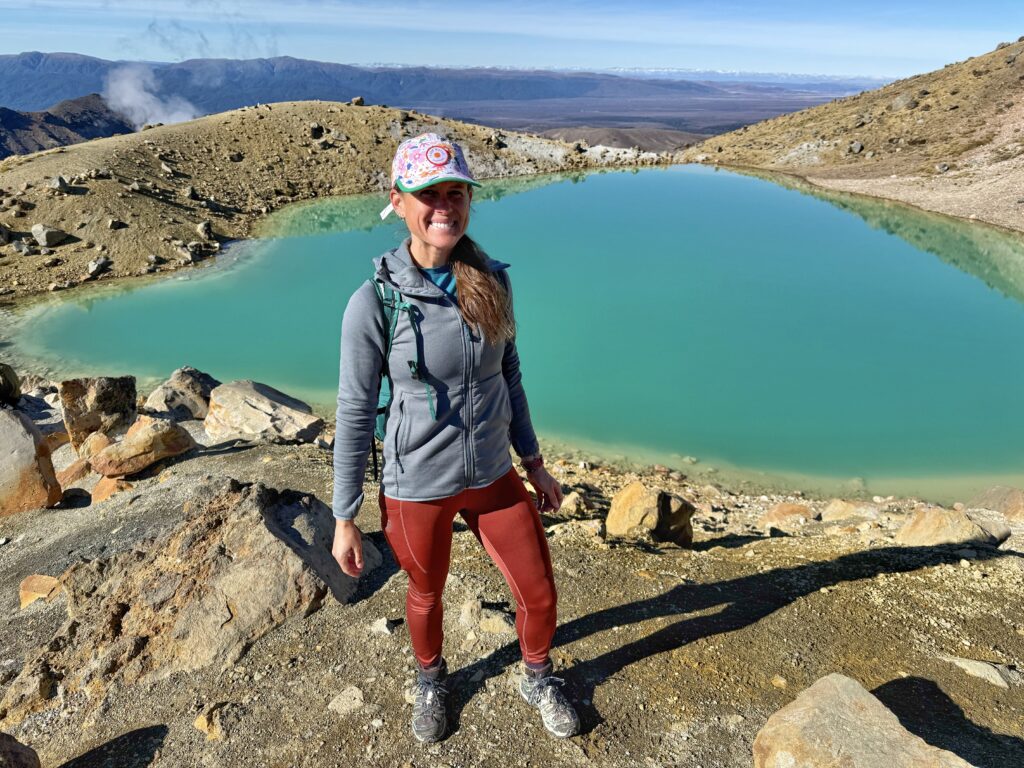Woman in front of the volcanic lake on Tongariro Alpine Crossing